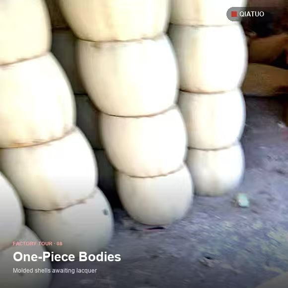 Stacked cream one-piece pressed drum shells stored before fitting at QiaTuo